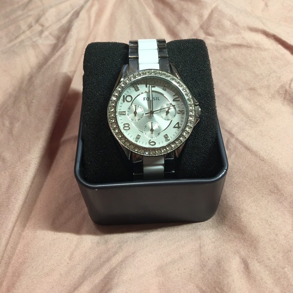 White and silver fossil watch
